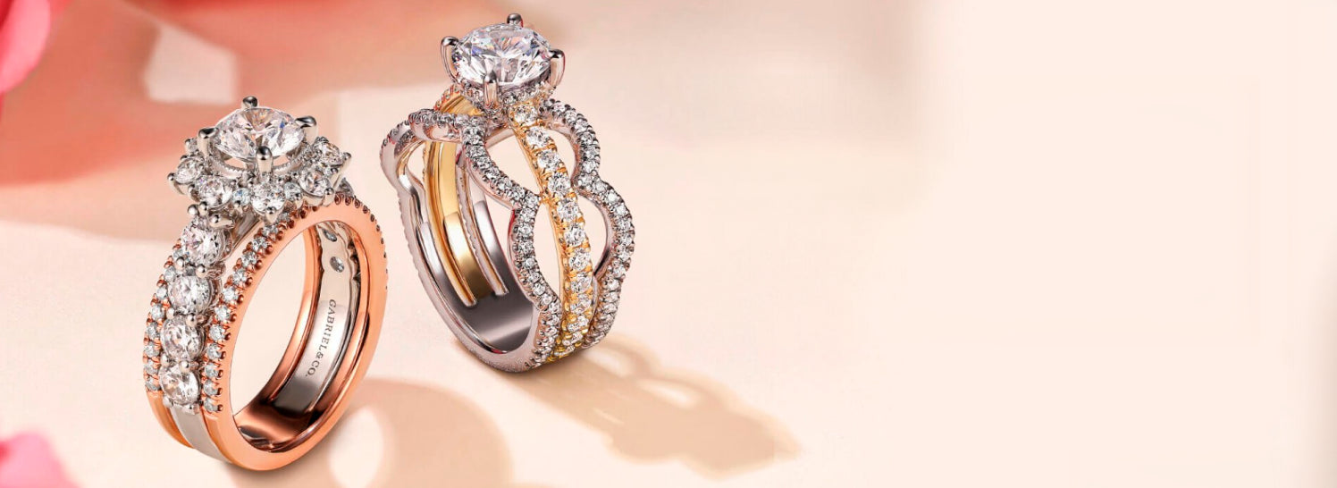 Two diamond rings on a light background